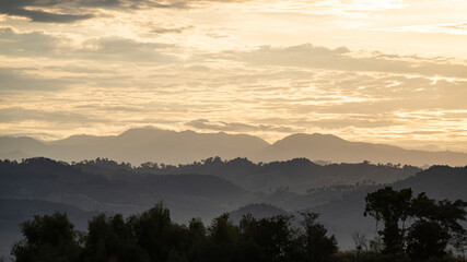 Fototapeta premium The sky is filled with beautiful white clouds. At sunset, the evening has warm light. Silhouette