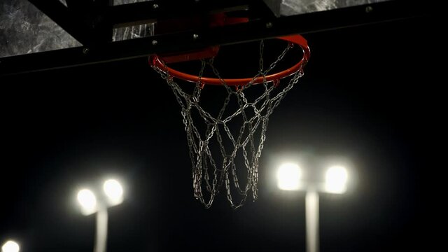Basketball hoop. Competition for the ball at the opponent's hoop. Attempts to throw the ball into the ring. A tense moment. Athletic competitions.