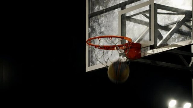 Basketball reaching to hoop. Scoring the winning points at a basketball game. Athletic competitions. Basketball Shot.