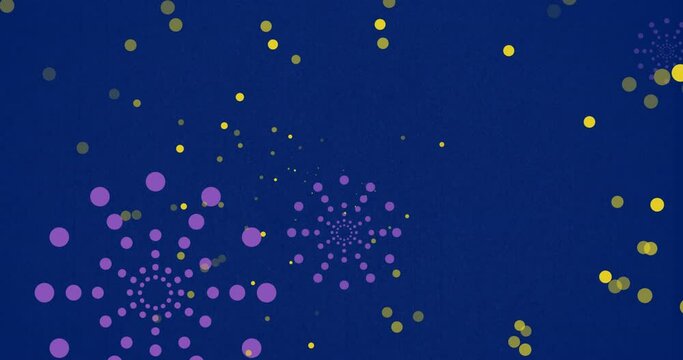Animation of purple firework explosions and bokeh yellow light spots on blue background