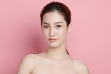 Beautiful young asian woman with clean fresh skin on pink background, Face care, Facial treatment, Cosmetology, beauty and spa, Asian women portrait.