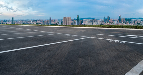 Fototapeta premium Empty asphalt road and city skyline and building landscape, China.