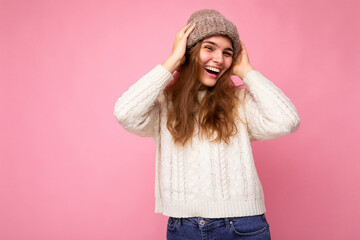 Beautiful positive happy young brunette woman isolated over colourful background wall wearing casual stylish clothes feeling sincere emotions looking at camera