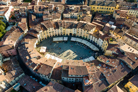 Aerial view of Piazza dell'Anfiteatro, a medieval square with caf&egrave; and market in Lucca old town, Tuscany, Italy.