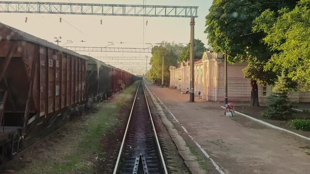 Railroad communication. Railway junction. Railway platform. Transportation. Train in motion. Departure from the station. Trips. Tourism.