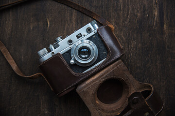 Retro photo camera with a leather case.
