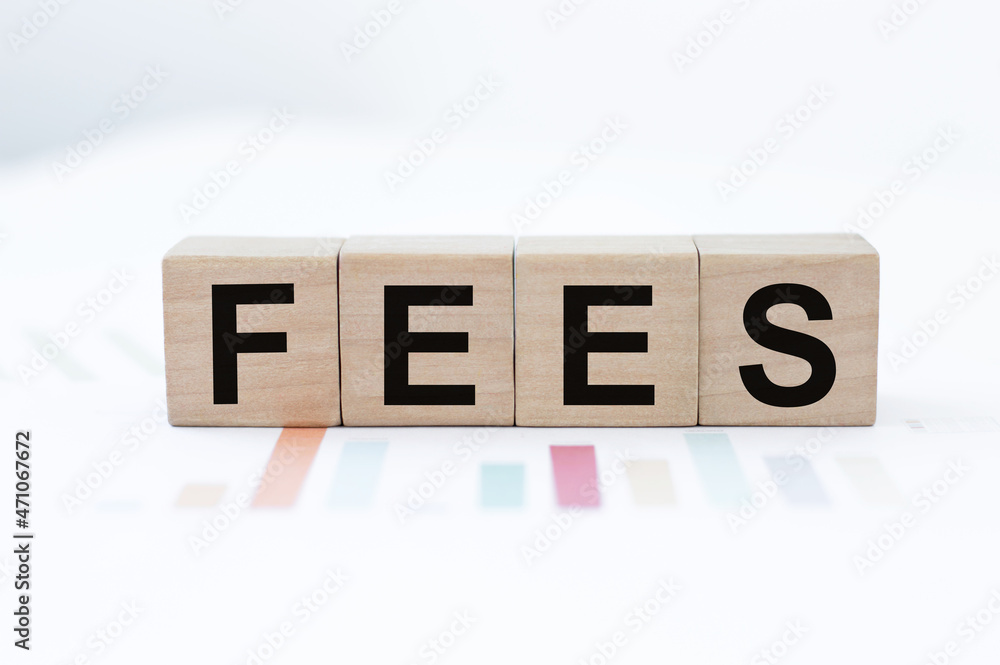 Poster fees on wooden blocks. fixed price for a specific service. business concept.