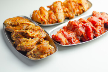 Three different set of the chicken wings with sriracha glaze, Caribbean marinade and Chinese glaze