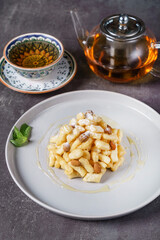 Tatar cookies with honey, pieces of dough and honey