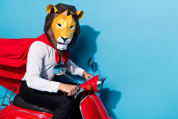 Photo of weird freak fantasy guy in lion mask ride scooter safe world theme festive event isolated...