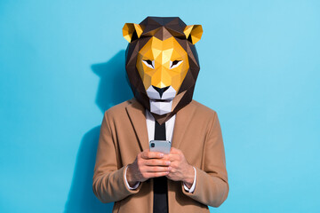 Photo of weird guy lion mask use smart phone texting halloween event invite theme send isolated...