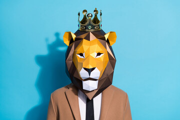 Portrait of weird authentic guy in lion mask wear gold tiara enjoy proud power isolated over blue...