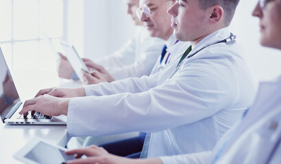 Medical team sitting and discussing at table