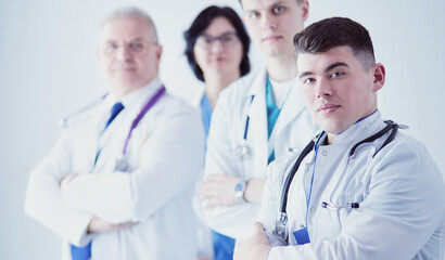 Fototapeta premium Successful medical team. Confident doctors team standing together and smiling