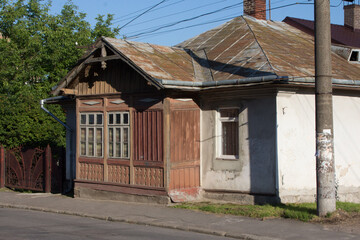 Fototapeta na wymiar Historic wooden cottage on the street of Drohobych. Ukraine 