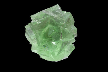 isolated green fluorite crystal mineral in black background - obrazy, fototapety, plakaty
