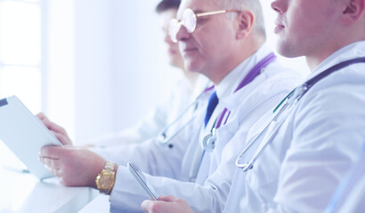 Medical team sitting and discussing at table