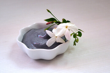 Activated carbon and yoghurt face mask. Natural cosmetics concept