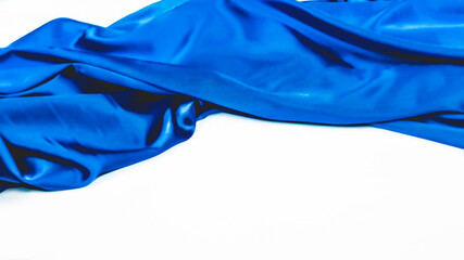 Beautiful flowing fabric of blue wavy silk or satin