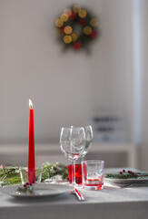 winter holidays, dinner party and celebration concept - close up of christmas table serving at home