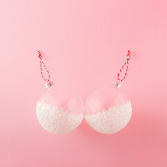 Lace and glass Christmas baubles concept against pink background.Surreal minimal winter holidays...