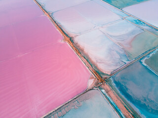 Pink and blue lakes of salt industry. Aerial top down view. Abstract nature background....
