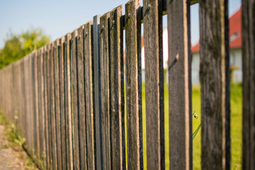 Wood picket fence with grass