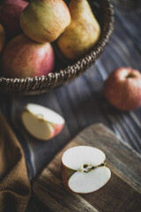still life apples in a wicker basket on a wooden table