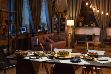Image of dining table with food and appetizer preparing for dinner party in the living room