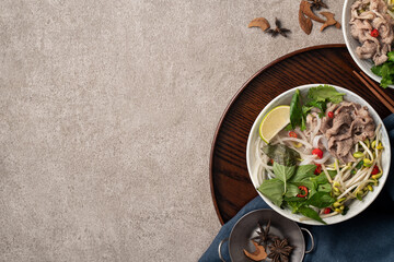Delicious vietnamese beef noodles pho with ingredients.