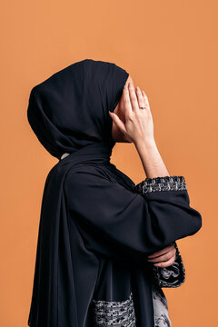 Side profile of young muslim woman
