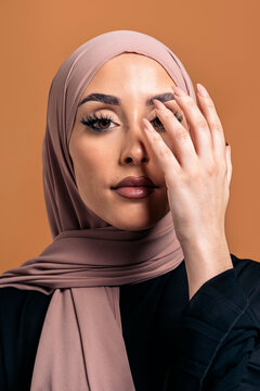 Young muslim woman looking at camera.