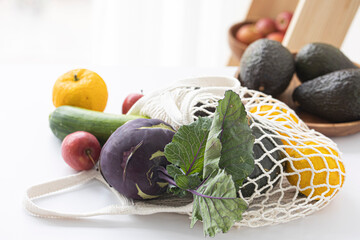 Fruits and vedetables in ecological reusable mesh bags made of organic cotton.