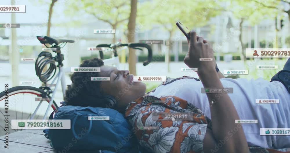 Poster animation of social media icons and numbers over smiling man using smartphone