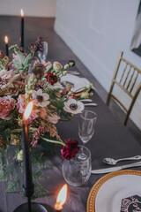 Wedding bouquet of flowers in a vase on a reception table for bride and groom 
