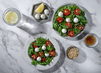 Salad with tomatoes, herbs and mini mozzarella