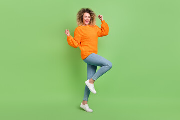 Fototapeta na wymiar Full body photo of hooray blond curly hairdo lady yell wear orange sweater jeans footwear isolated on green background
