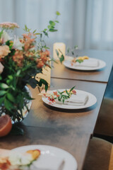 Citrus orange wedding table setting decorations with flowers and fruit 