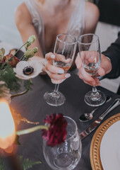 wedding couple toasting champagne at dinner