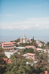 Obraz premium Scenic view of the city in the mountains. Sunny day. Panoramic top view of the old European city with ancient buildings. High quality photo