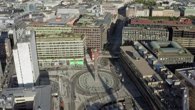 Aerial view urban cityscape Stockholm. Square in the historic center of the old town with roundabout cars and people.