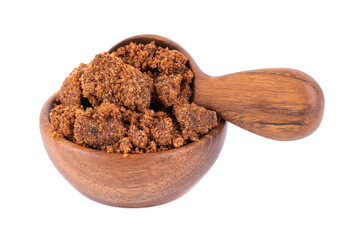 Muscovado sugar in wooden bowl and spoon, isolated on white background. Barbados sugar, khandsari...