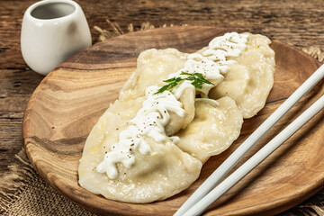 Traditional Dumplings with soy sauce. Traditional Oriental cuisine