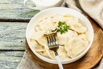 Dumplings with cottage cheese and sour cream