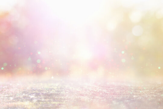 background of abstract gold, pink and silver glitter lights. defocused