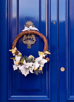 Original Christmas Wreath On The Blue Door. Traditional Door Decoration For Christmas