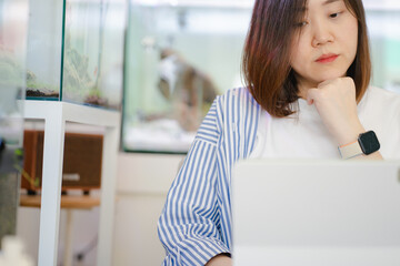 asian freelancer woman during creative and work by use tablet with happiness feeling