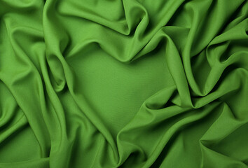 Green heart shape textile fold pleats background
