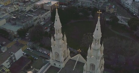 Aerial flying over a church in San Francisco North Beach. Saints Peter and Paul Church in little Italy