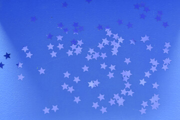 Stars background. Different colours. Christmas decoration. Symbol of holiday. Stars.Top view flatlay . background for children's party. Design of Greeting Card With Christmas stars.